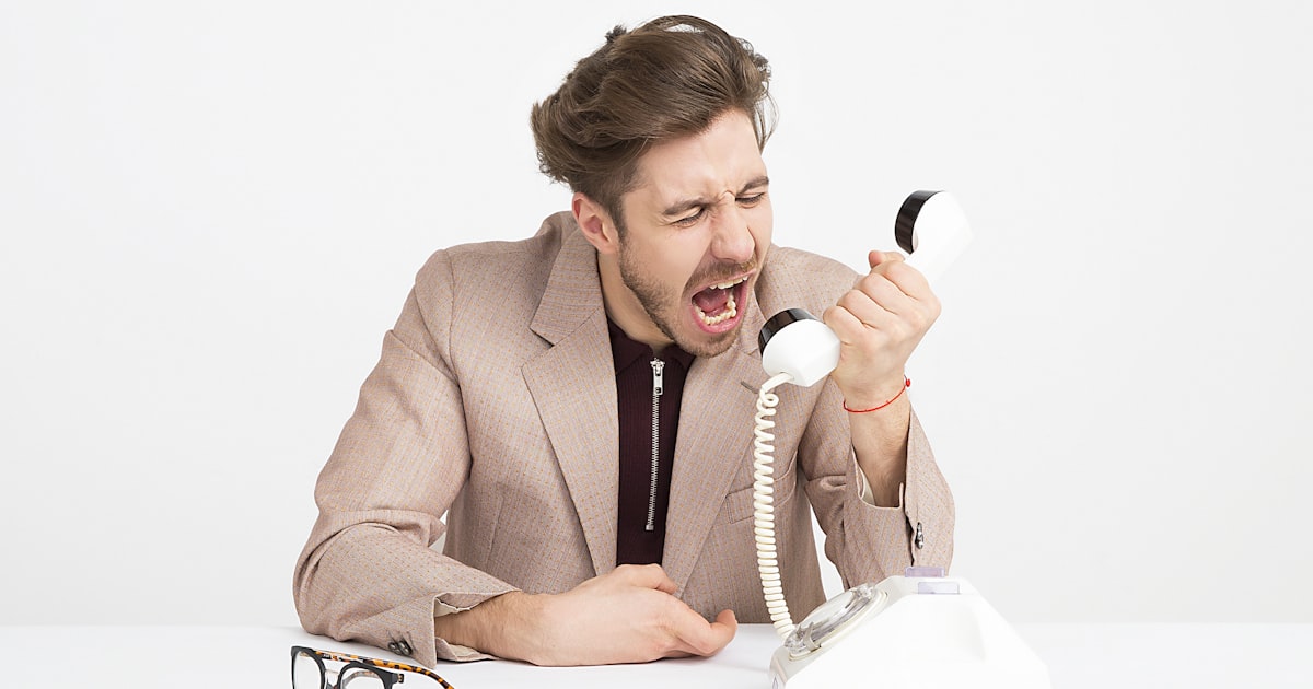 Man shouting at a telephone